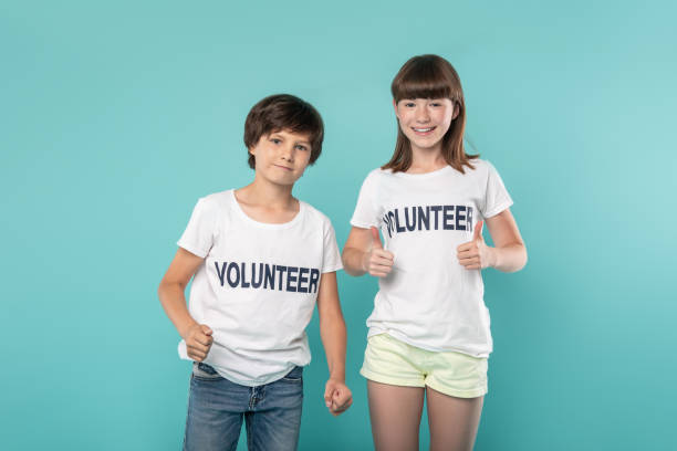 istock Alert young volunteers showing thumbs up 988254918