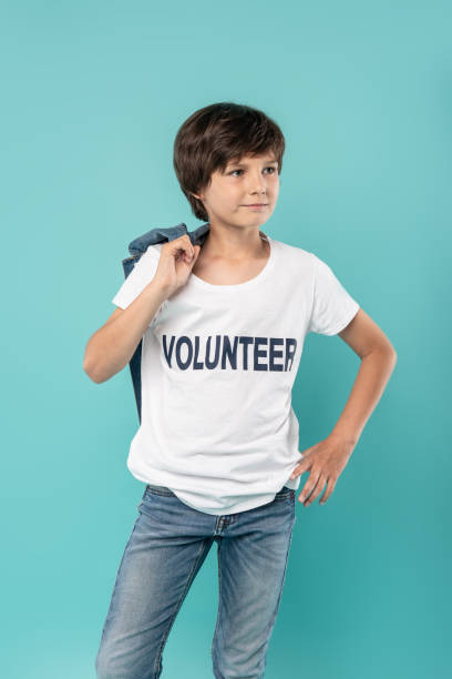 istock Alert young volunteer holding his jacket 988259750