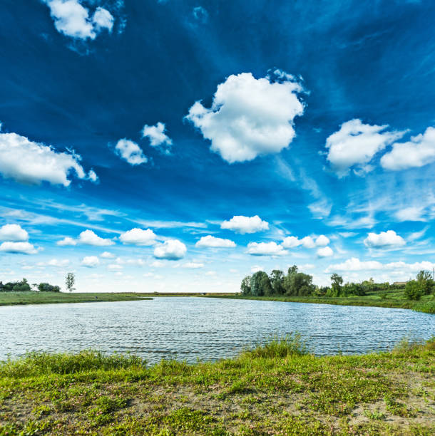 istock view on lake and beautiful cloudy  skyes 988274850