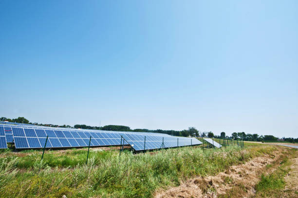 Solar Farm Behind A Fence stock photo
