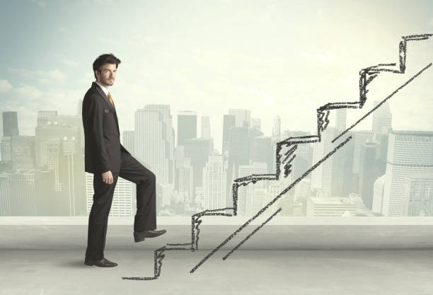 istock Business man climbing up on hand drawn staircase concept 988292476