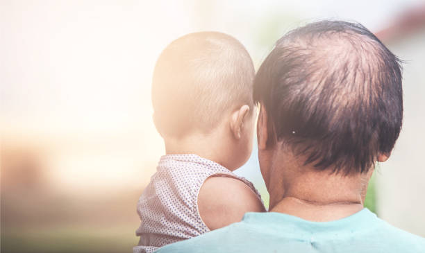 istock Grandfather And Granddaughter 988327500