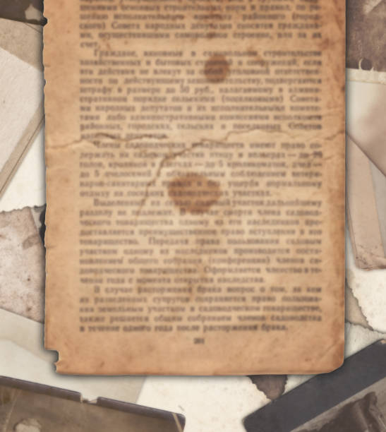 istock Vintage newspaper on the old photos background 988331036