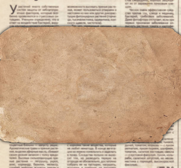 istock Vintage paper on the old newspaper texture 988335498