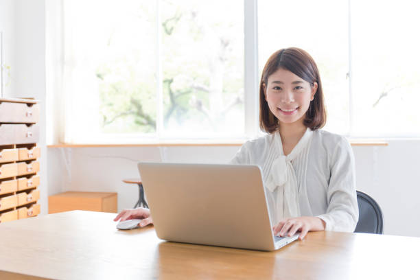 istock A woman who plays a personal computer in a room 988341580