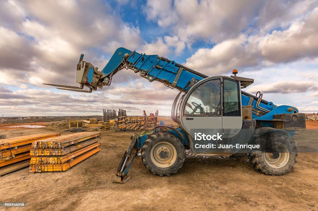 Forklifts in the works of the ring road of Segovia in Spain Transporting heavy elements for the bridge structure Forklift Stock Photo