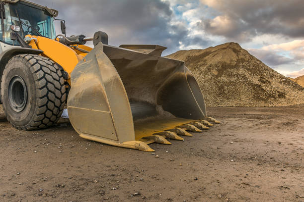istock Excavator in an open-air mine 988347820