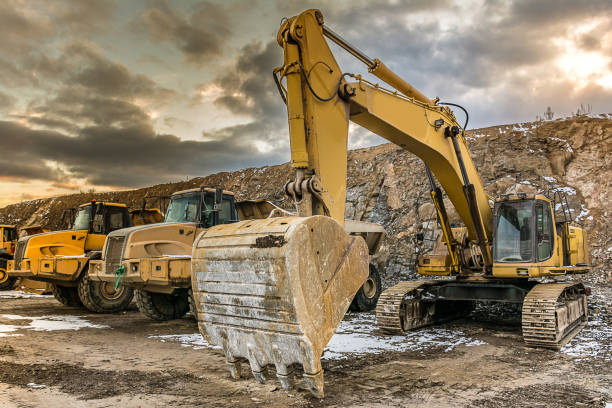 istock Trucks and excavators on construction sites of a highway 988351180