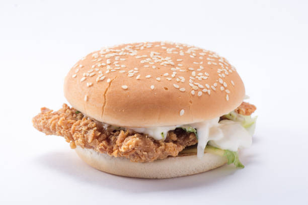 istock Crispy chicken burger with lettuce, cheese, and mayonnaise 988353670