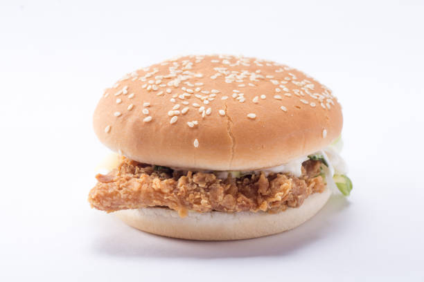 istock Crispy chicken burger with lettuce, cheese, and mayonnaise 988353726