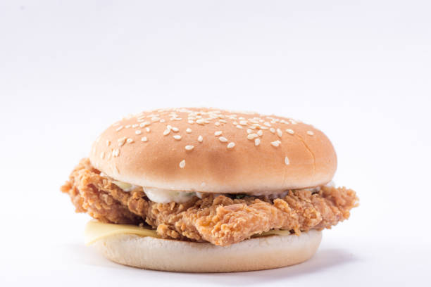 istock Crispy chicken burger with lettuce, cheese, and mayonnaise 988353802
