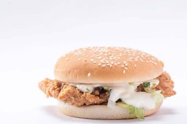 istock Crispy chicken burger with lettuce, cheese, and mayonnaise 988353880