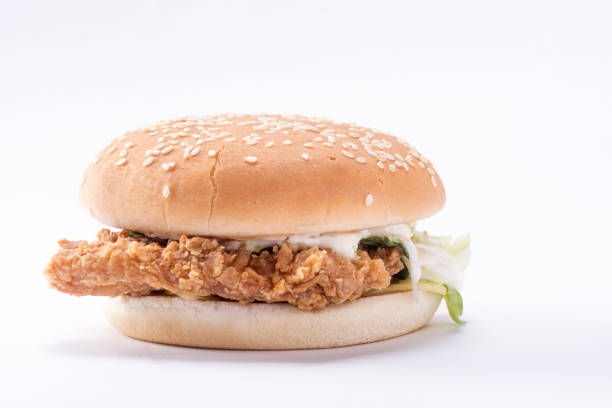 istock Crispy chicken burger with lettuce, cheese, and mayonnaise 988353918