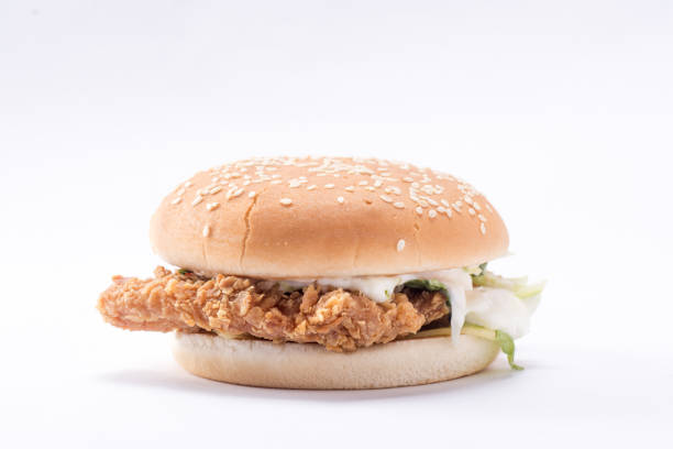 istock Crispy chicken burger with lettuce, cheese, and mayonnaise 988354044