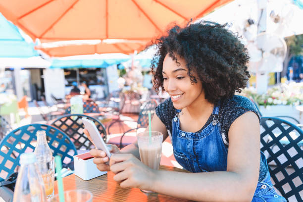 istock woman drinking cocktail outdoors 988357418
