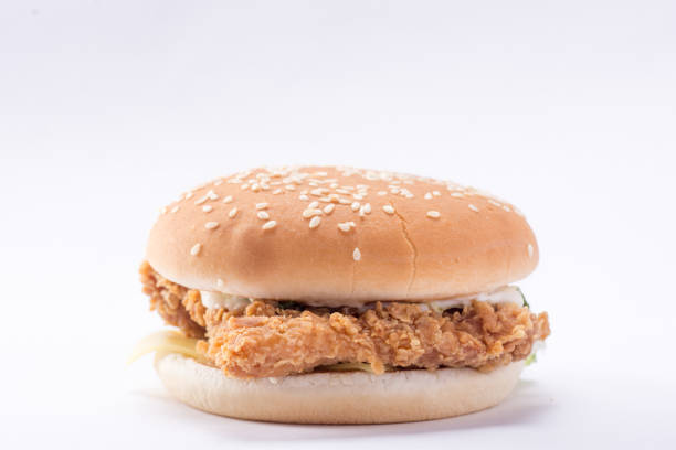 istock Crispy chicken burger with lettuce, cheese, and mayonnaise 988359268