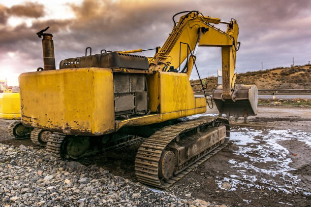 istock Excavator making earth movements making a road in Spain 988359920