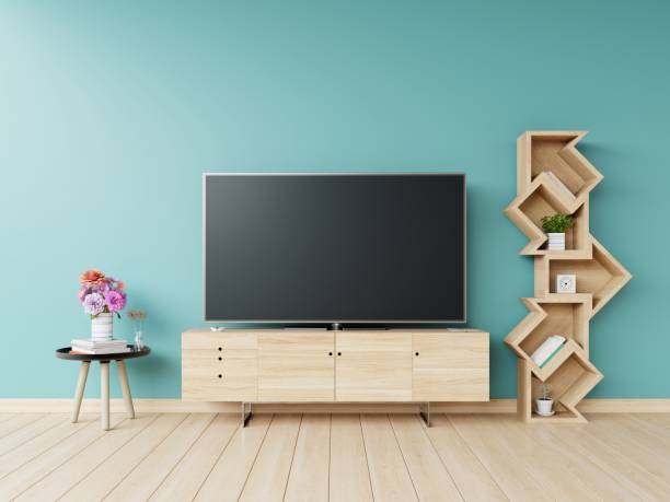 istock Led tv on cabinet and shelf,table,flower 988363664