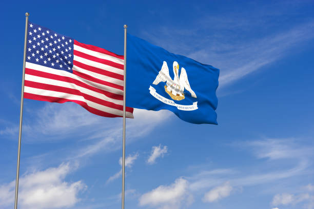 istock USA and Louisiana flags over blue sky background. 3D illustration 988367718