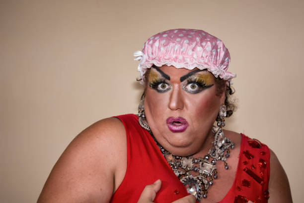 Funny drag Queen actor. Fat man. Brown background.