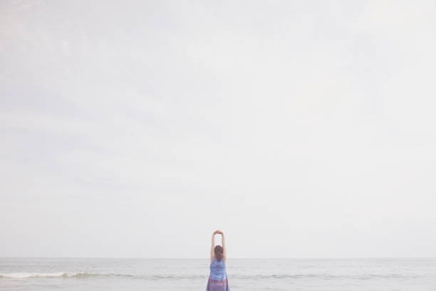 istock Woman relaxed at seaside 988369546