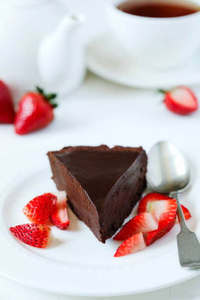 istock Piece of chocolate cake served with strawberries 988373308