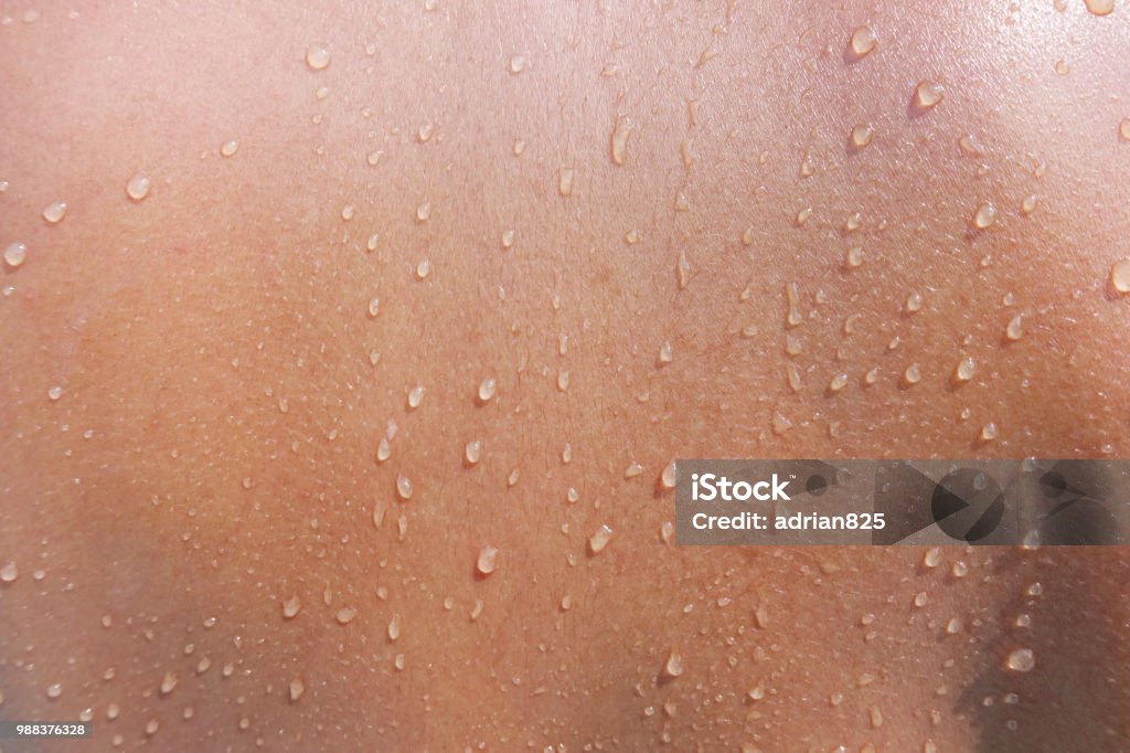 Water drops on woman skin, close up of wet human skin texture Skin Stock Photo