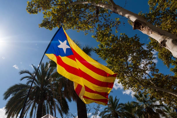 istock Senyera -Catalan separatists flag against sky 988412132