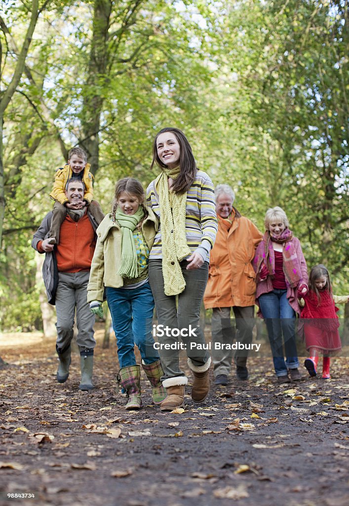 Extended family walking outdoors in autumn  Family Stock Photo