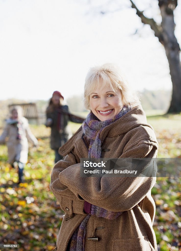 Smiling woman in coat outdoors in autumn  One Woman Only Stock Photo