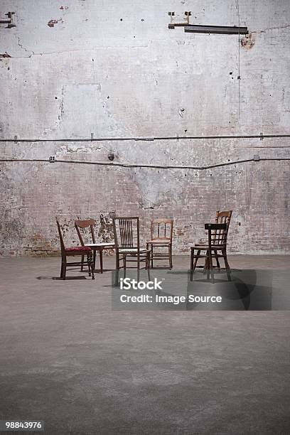 Chairs In Empty Warehouse Stock Photo - Download Image Now - Absence, Chair, Color Image