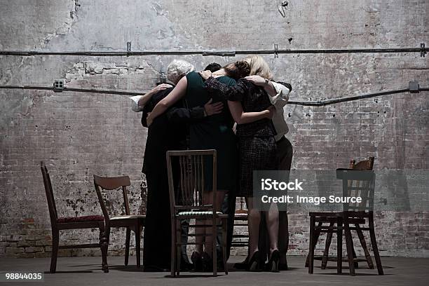 Group Of Businesspeople In Warehouse Stock Photo - Download Image Now - Chair, Huddling, Adult