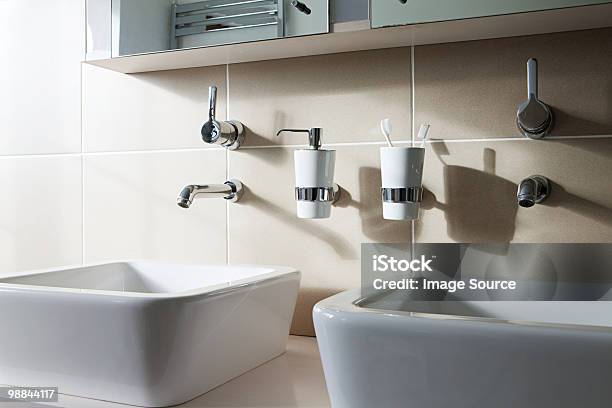 Two Sinks Stock Photo - Download Image Now - Toothbrush Holder, Bathroom, Beige