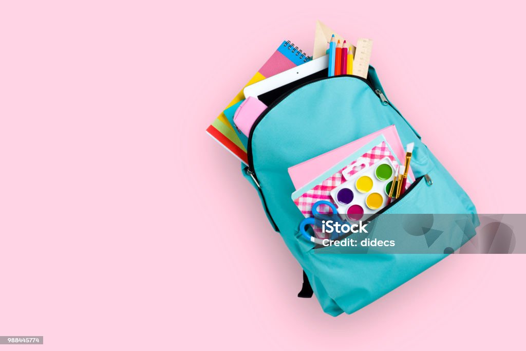 Full school backpack isolated on pink background Backpack Stock Photo