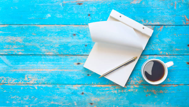 istock Notebook, ballpoint pen pen and a cup of coffee, idea, notice, brainstorming concept 988484676
