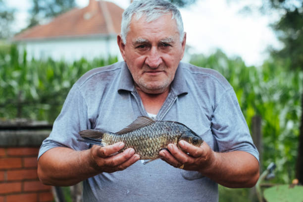 istock Elderly fisherman 988485290