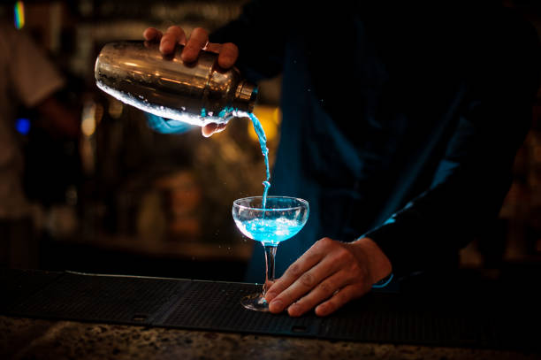 istock Barman making cocktail at nightclub 988485354