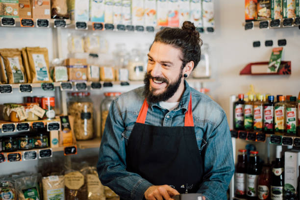 istock Happy young man at the store 988485612