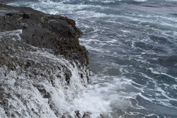 istock Tide at Enoshima island, Japan 988489752