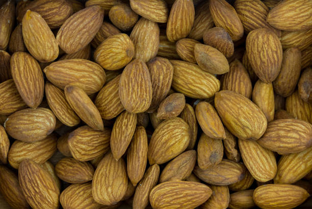 istock almonds large delicious walnut, base of desserts and marzipan, background base 988490436