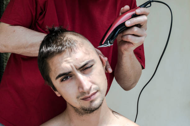 Young Adult Man Getting His Hair Cut.