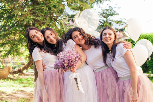 istock Happy lovely girlfriends at hen party 988490612
