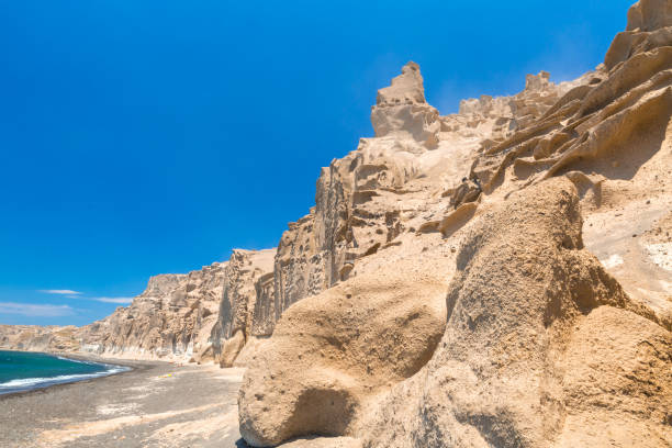 istock Beautiful beach with volcanic mountains. Vlychada beach, Santorini, Greece 988505174