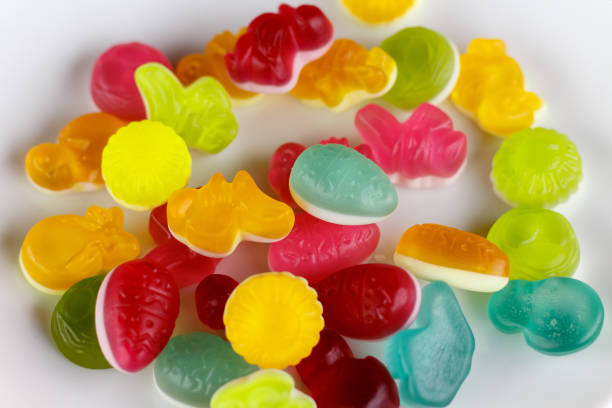 istock colored rubber candies in a white bowl. 988507010