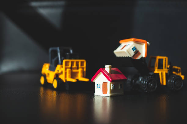 istock Miniature house and transportation vehicle 988507462