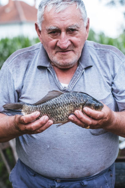 istock Elderly fisherman 988518444