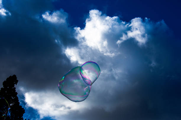 istock soap bubbles against sun and sky as abstract background or wallpaper 988525382