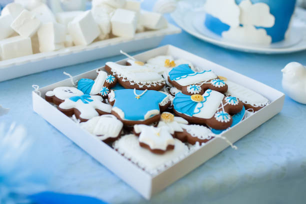Candy bar on baby's christening party: various gingerbreads with blue mastic for little boy.