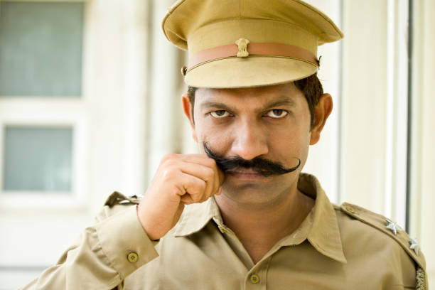 Police Officer Holding His Mustache Stock Photo - Download Image Now -  Police Force, Anger, India - iStock