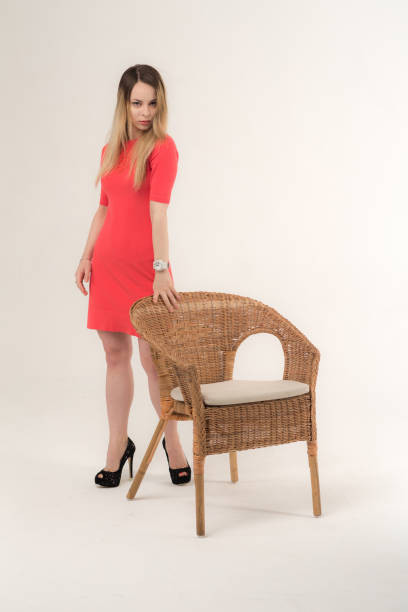 istock slim girl with an armchair 988541128